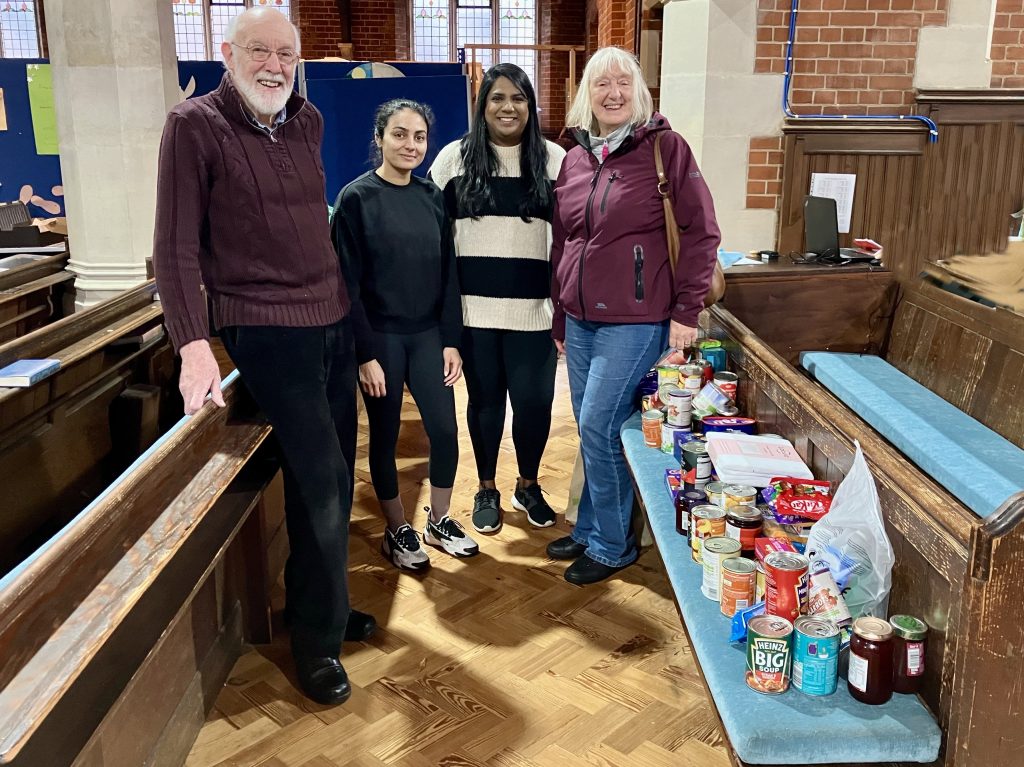 Cantilena Singers giving donated food to Purley Food Hub after their Christmas Concert 2023
